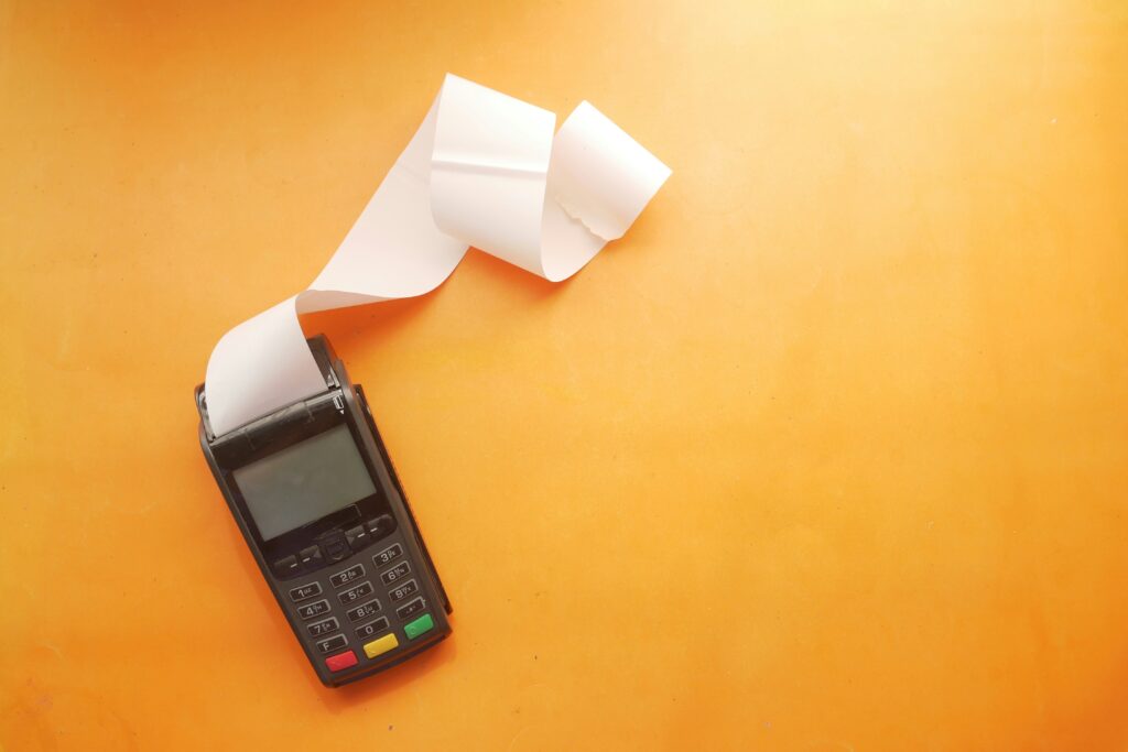 Card reader with a lot of receipt paper spewed out