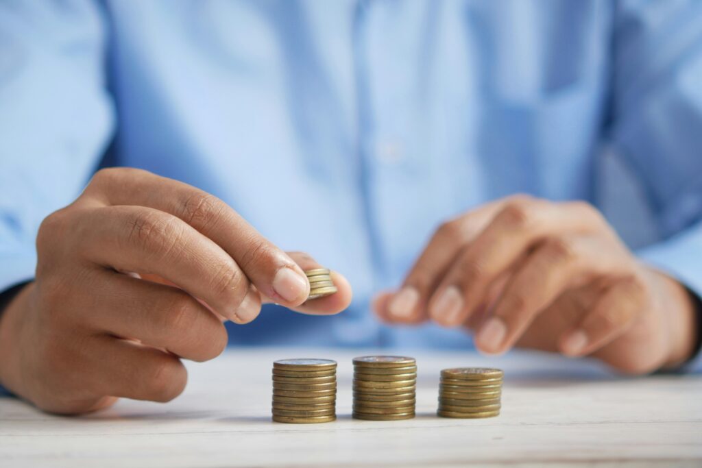 Person stacking coins