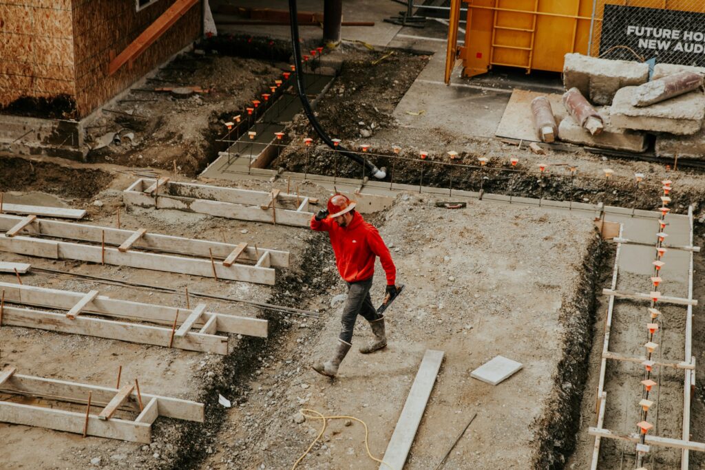 Construction worker walking across a site