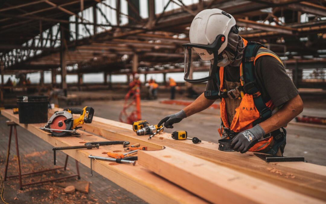 Person working on lumber with power tools